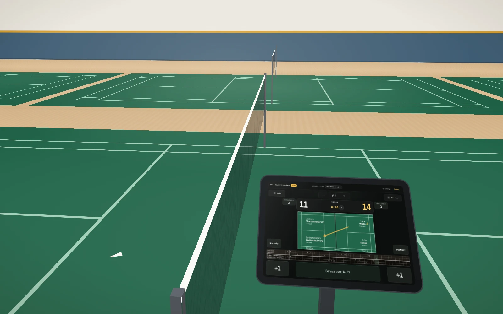 An umpire chair beside the net, with a tablet on it showing the umpire panel.